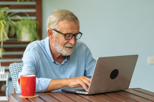 senior man applying for Medicare online