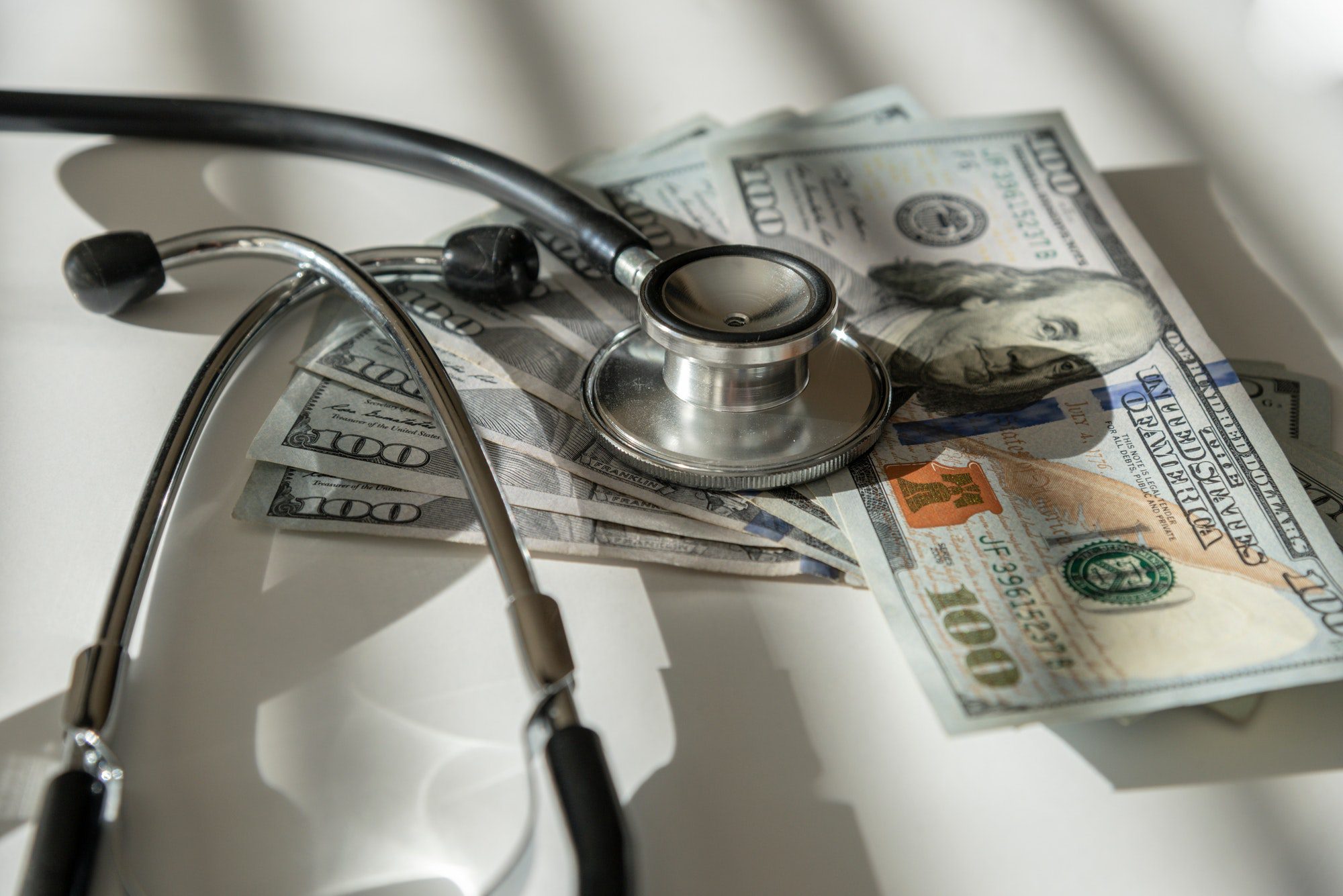 Stethoscope and money representing the cost of Medicare Part C and D in 2022