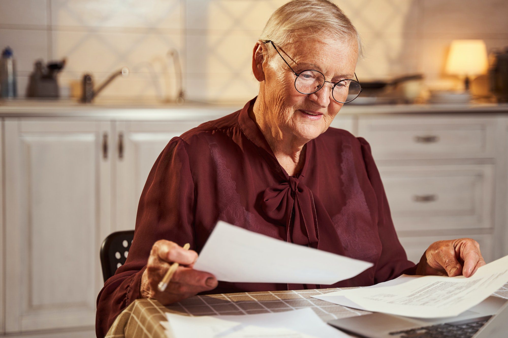 Senior woman comparing Medicare Plans to determine which is right for her.